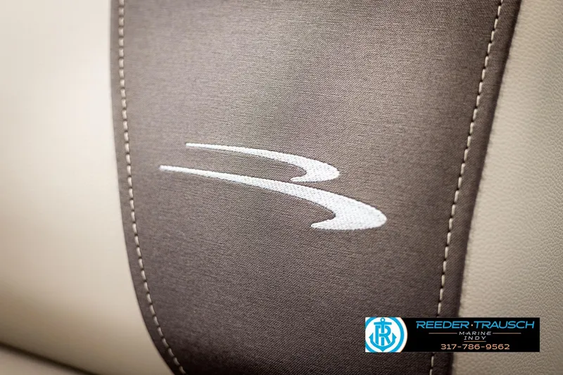 Slide: The Image of Close-up of 2025 Bennington 21 SL boat seat with logo and stitching detail. - 32
