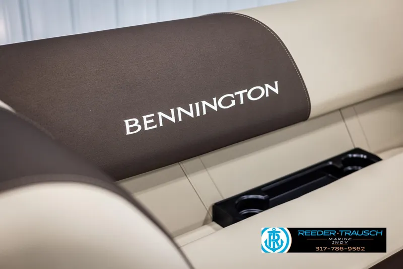 Slide: The Image of 2025 Bennington 21 SL boat seat with logo and cup holders. - 33