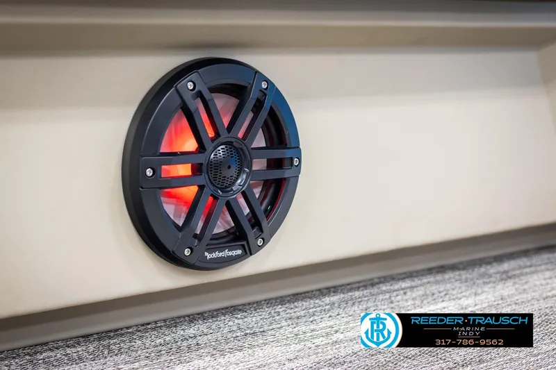 Slide: The Image of 2025 Bennington 21 SL boat speaker with red LED lighting, Reeder-Trausch Marine logo. - 35