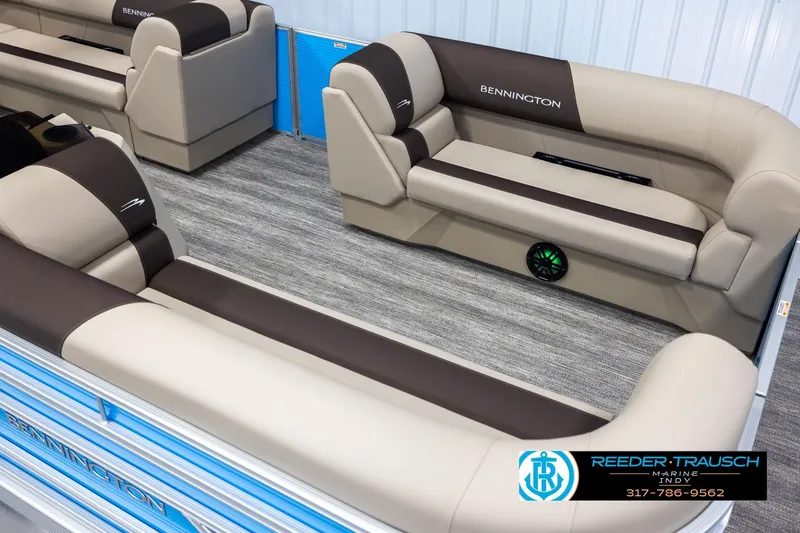 Slide: The Image of 2025 Bennington 21 SL pontoon boat interior with beige and brown seating. - 9