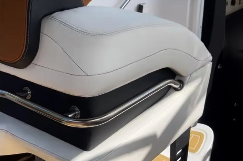 Slide: The Image of White and black boat seat with metal handle, Baja 38, 1997 model. - 13