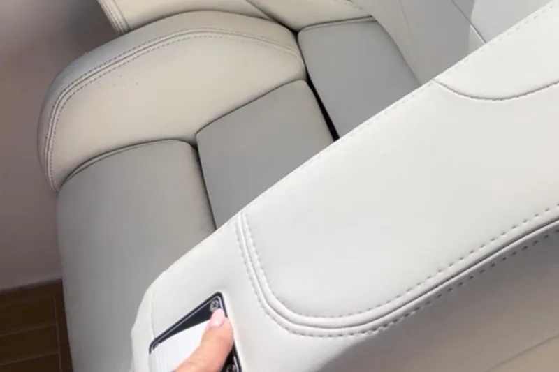 Slide: The Image of White leather seating in a 1997 Baja 38 boat interior. - 14