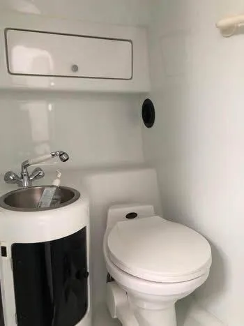 Slide: The Image of 1997 Baha Cruisers 38 boat bathroom with sink and toilet. - 19