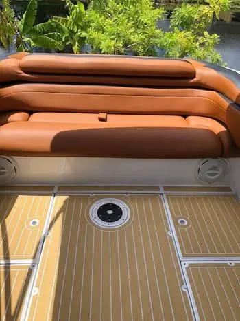 Slide: The Image of 1997 Baha Cruisers 38 boat with tan leather seating and wooden deck. - 2
