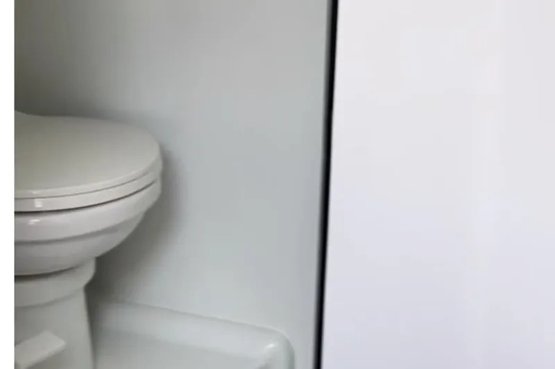 Slide: The Image of Toilet in 1997 Baja 38 boat interior, white and compact design. - 25