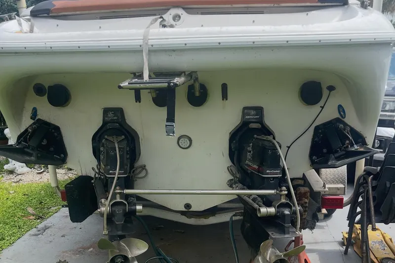 Slide: The Image of Rear view of a 1997 Baja 38 boat with dual Mercury outdrives. - 27