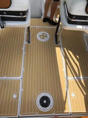 Slide: The Image of 1997 Baha Cruisers 38 boat deck with teak-style flooring and seating. - 5
