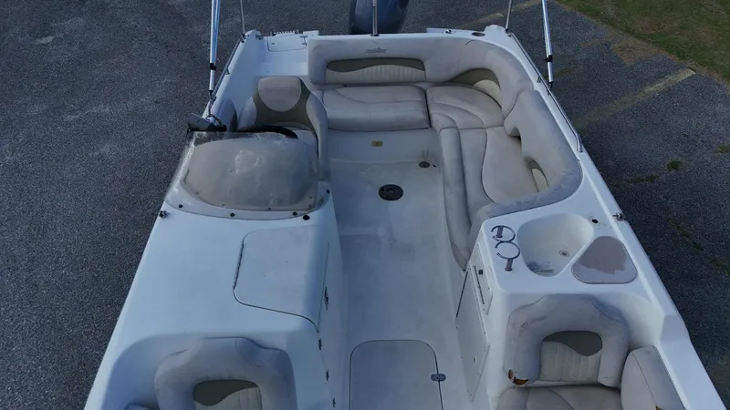 Slide: The Image of 2010 NauticStar 210 SC boat interior with spacious seating and cup holders. - 5