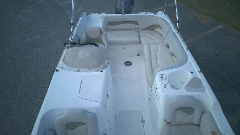 Slide: The Image of 2010 NauticStar 210 SC boat interior with spacious seating and cup holders. - 6