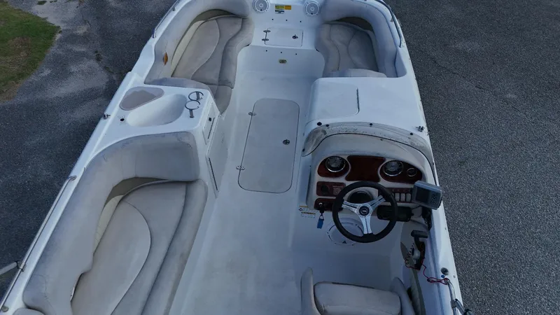 Slide: The Image of 2010 NauticStar 210 SC boat interior with seating and steering console. - 8