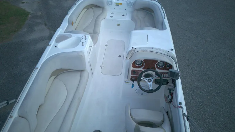 Slide: The Image of 2010 NauticStar 210 SC boat interior with seating and steering console. - 9