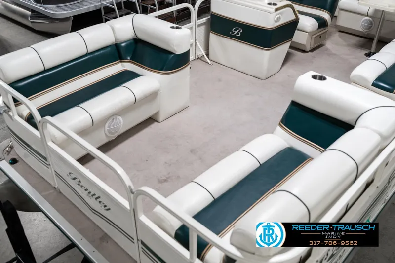 Slide: The Image of 2005 Bentley Pontoons 200 CRUISE interior with white and green seating, Reeder-Trausch Marine logo. - 11