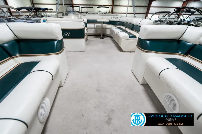 Slide: The Image of 2005 Bentley Pontoons 200 CRUISE interior with white and green seating in a showroom. - 15