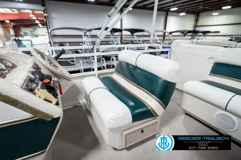 Slide: The Image of 2005 Bentley Pontoons 200 CRUISE interior with steering wheel and seating in showroom. - 22