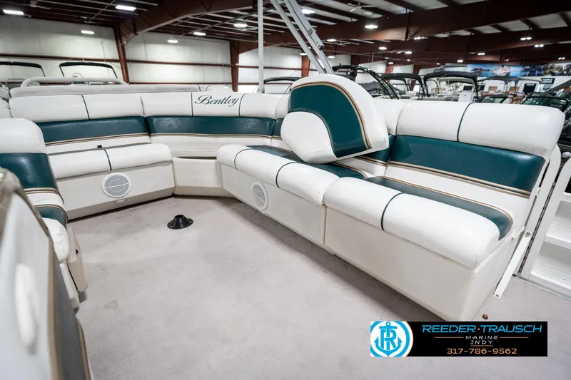 Slide: The Image of 2005 Bentley Pontoons 200 CRUISE interior with white and green seating in a showroom. - 27