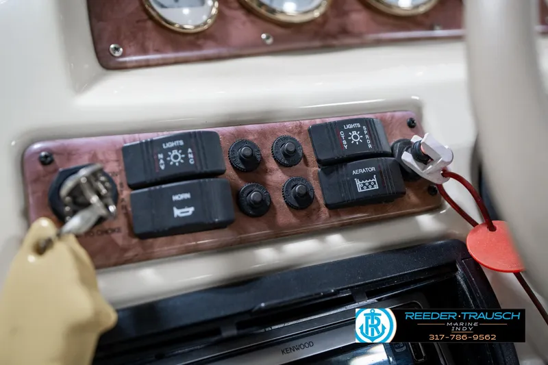 Slide: The Image of Control panel of a 2005 Bentley Pontoons 200 CRUISE with switches and key ignition. - 32