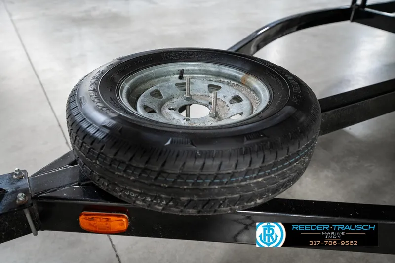 Slide: The Image of Spare tire on a trailer for a 2005 Bentley Pontoons 200 CRUISE. - 45