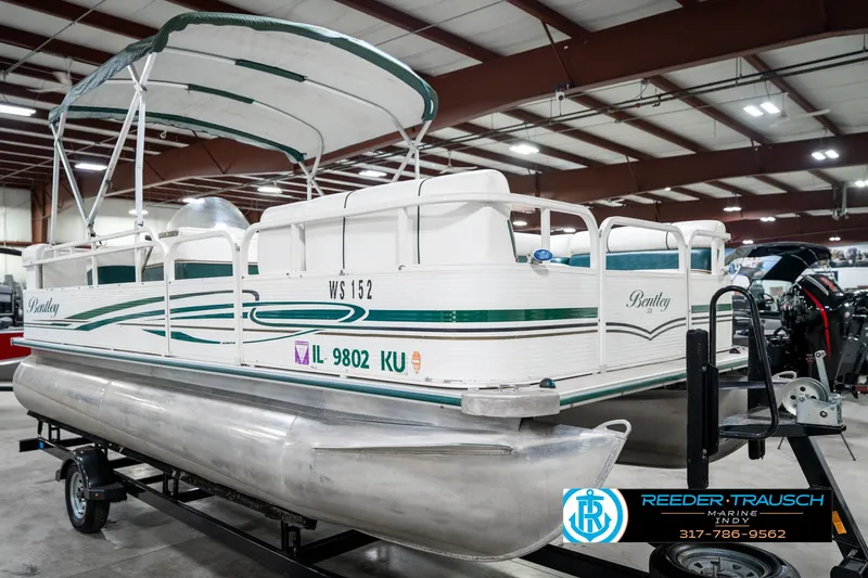 Slide: The Image of 2005 Bentley Pontoons 200 CRUISE boat on trailer in indoor showroom. - 5