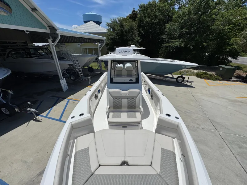 Slide: The Image of 2026 Solace 30 CS boat with Garmin equipment, docked at a marina under clear skies. - 22