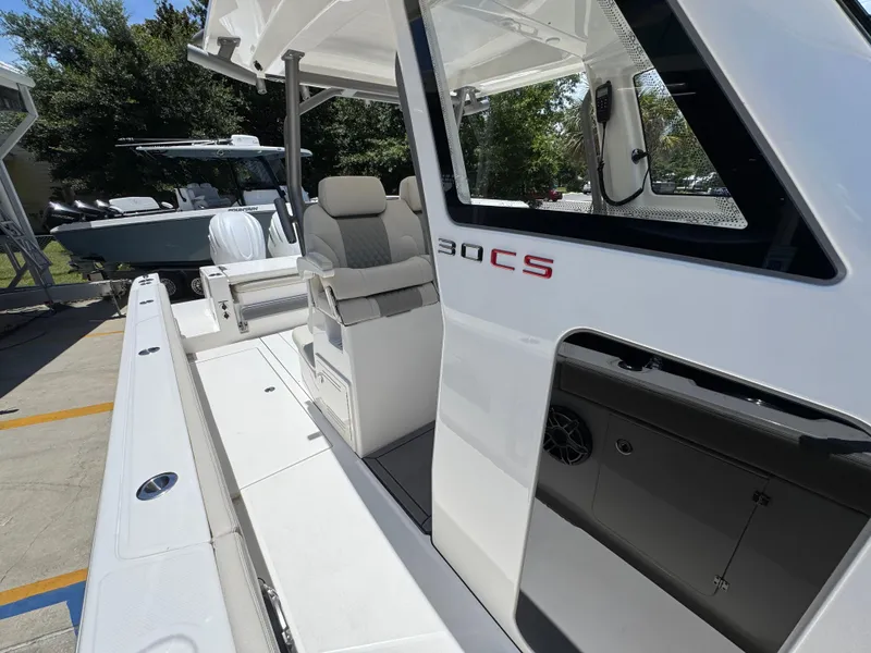 Slide: The Image of 2026 Solace 30 CS boat with sleek design and comfortable seating on display. - 25