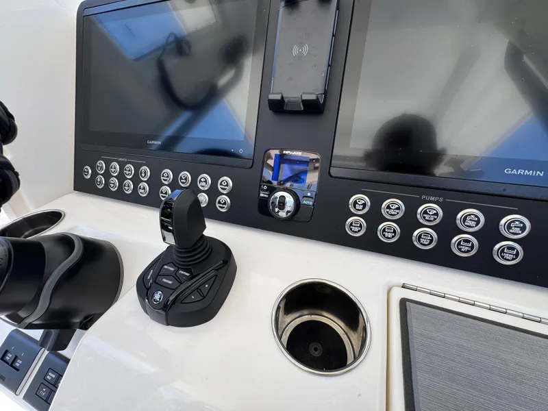Slide: The Image of Helm of 2026 Solace 30 CS boat with Garmin displays and joystick controls. - 33