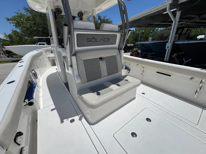 Slide: The Image of 2026 Solace 30 CS boat interior with cushioned seating and sleek design. - 34