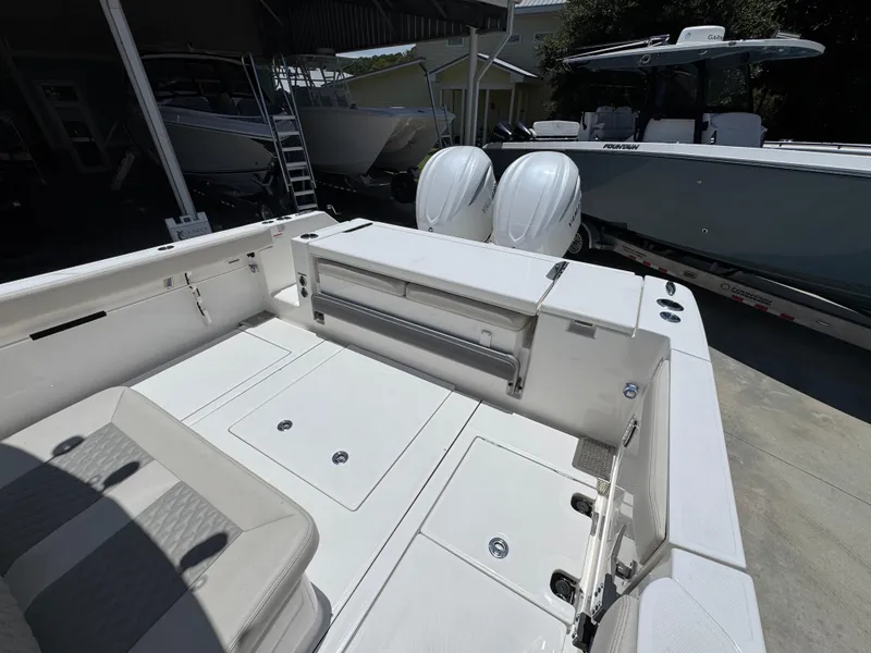 Slide: The Image of 2026 Solace 30 CS boat interior with dual engines, spacious deck, and seating area. - 36