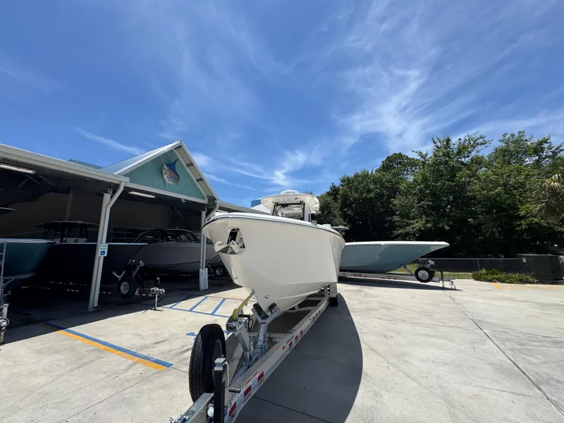 Slide: The Image of 2026 Solace 30 CS boat on trailer under clear blue sky. - 5