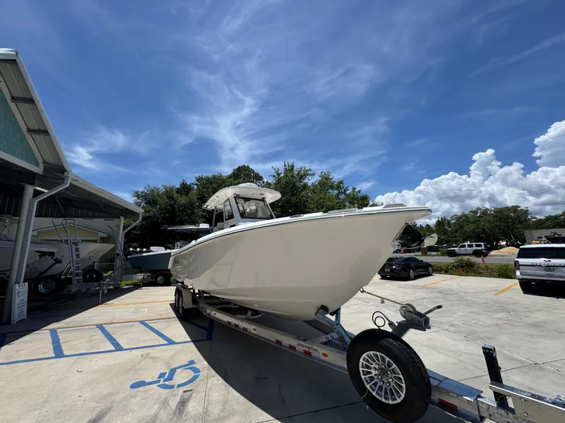 Slide: The Image of 2026 Solace 30 CS boat on trailer under clear blue sky. - 7