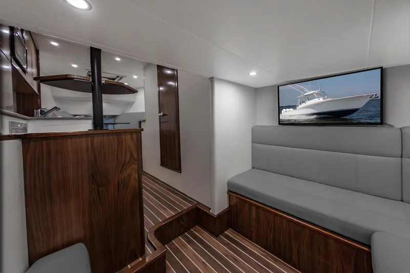 Slide: The Image of Luxurious interior of 2025 Albemarle 45 Carolinian yacht with modern seating and wood finishes. - 10