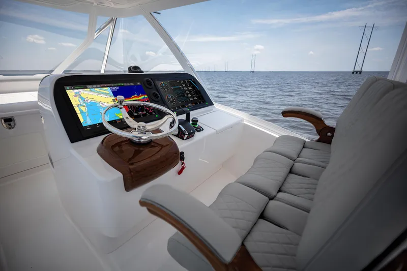 Slide: The Image of Helm of 2025 Albemarle 45 Carolinian boat with advanced navigation system and luxurious seating. - 16