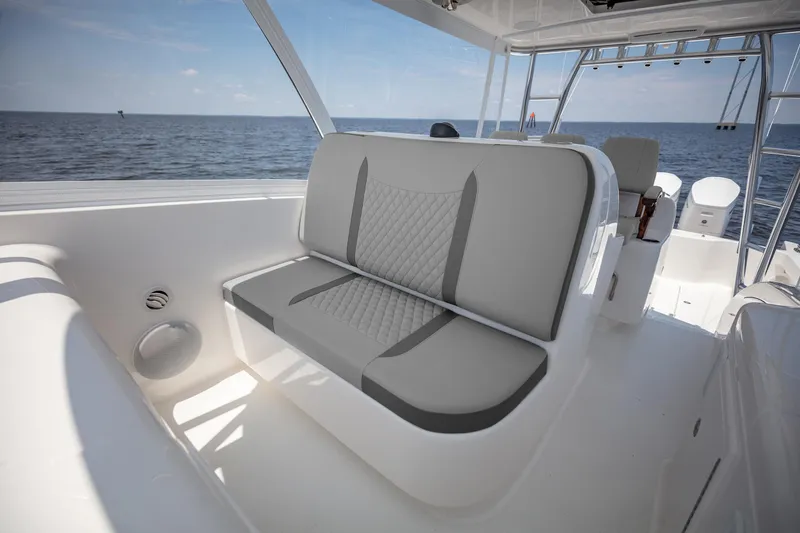Slide: The Image of 2025 Albemarle 45 Carolinian boat interior with gray seating, ocean view. - 18