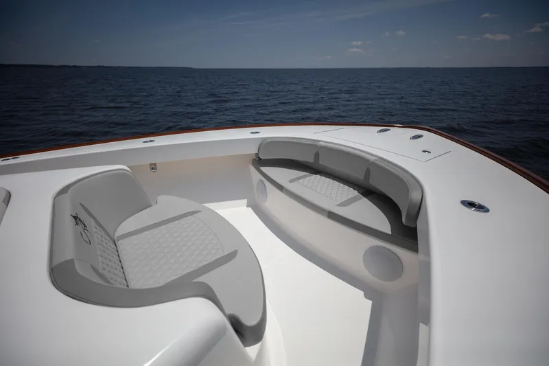 Slide: The Image of Bow seating area on 2025 Albemarle 45 Carolinian boat, overlooking calm ocean waters. - 20