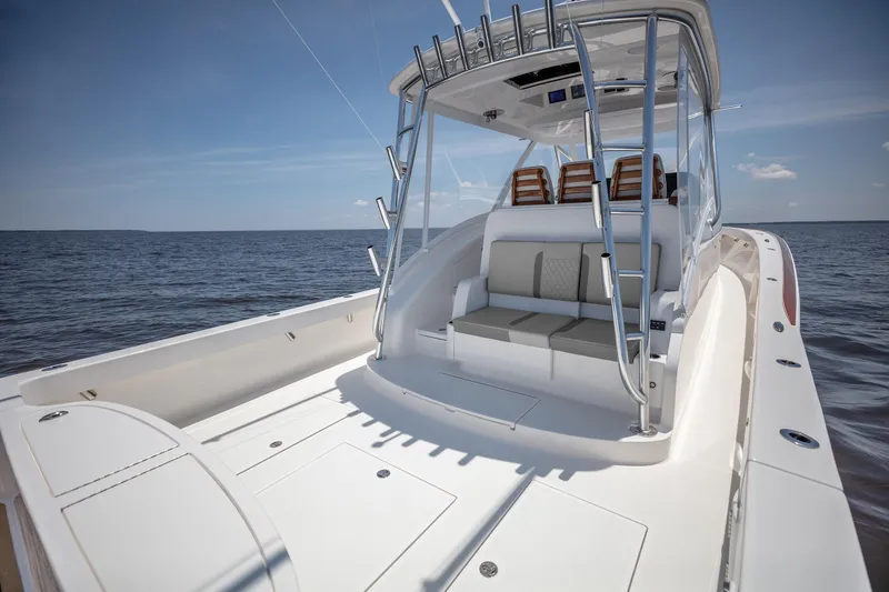 Slide: The Image of 2025 Albemarle 45 Carolinian boat on open water, featuring spacious deck and seating. - 22