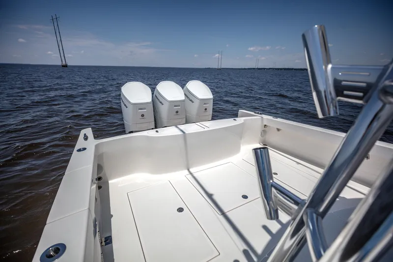 Slide: The Image of 2025 Albemarle 45 Carolinian boat with triple outboard engines on open water. - 24