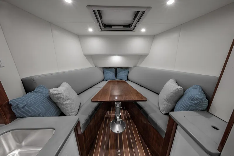 Slide: The Image of Luxurious interior of 2025 Albemarle 45 Carolinian yacht with elegant seating and table. - 8