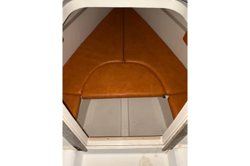 Slide: The Image of 1986 O'Day 19 sailboat interior with orange cushions. - 13