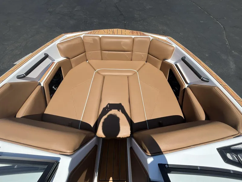 Slide: The Image of 2025 Moomba Tykon boat interior with tan leather seating and sleek design. - 11