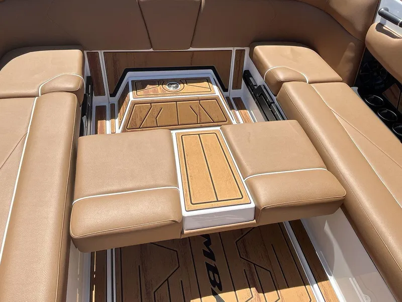 Slide: The Image of Luxurious interior of 2025 Moomba Tykon boat with tan leather seating and wood accents. - 22
