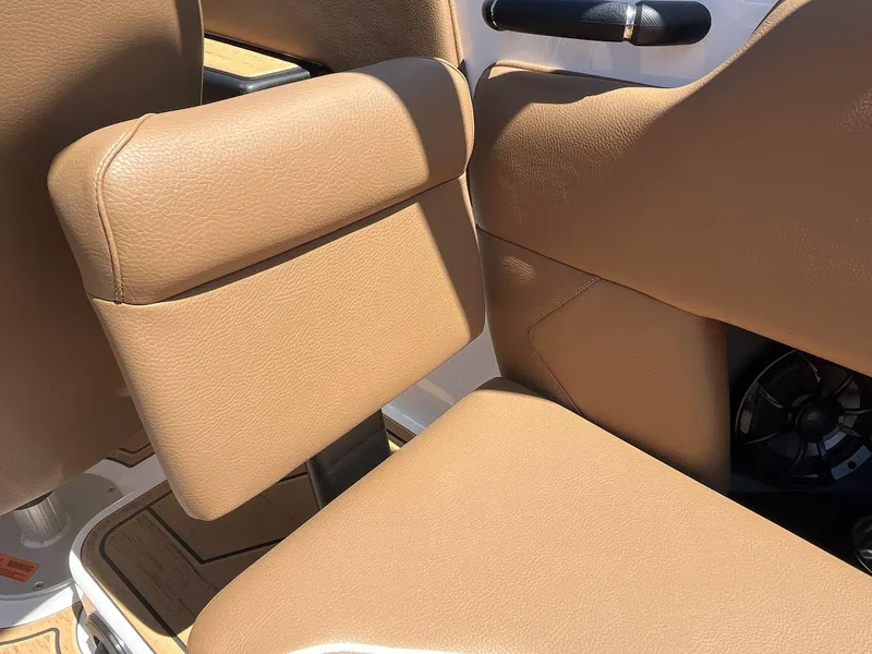 Slide: The Image of 2025 Moomba Tykon boat interior with tan leather seating and sleek design. - 23