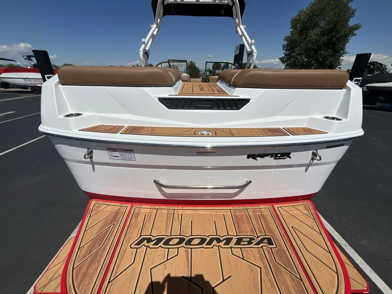 Slide: The Image of 2025 Moomba Tykon boat with teak deck and Raptor engine branding. - 4