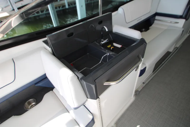 Slide: The Image of 2020 Formula 330 Crossover Bowrider interior with sink and seating area. - 16