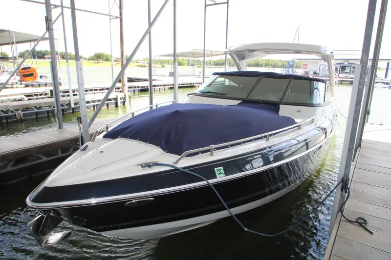 Slide: The Image of 2020 Formula 330 Crossover Bowrider docked, covered, and ready for adventure. - 18