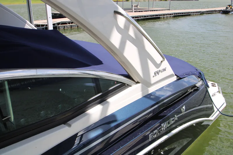 Slide: The Image of 2020 Formula 330 Crossover Bowrider docked on a sunny day. - 22