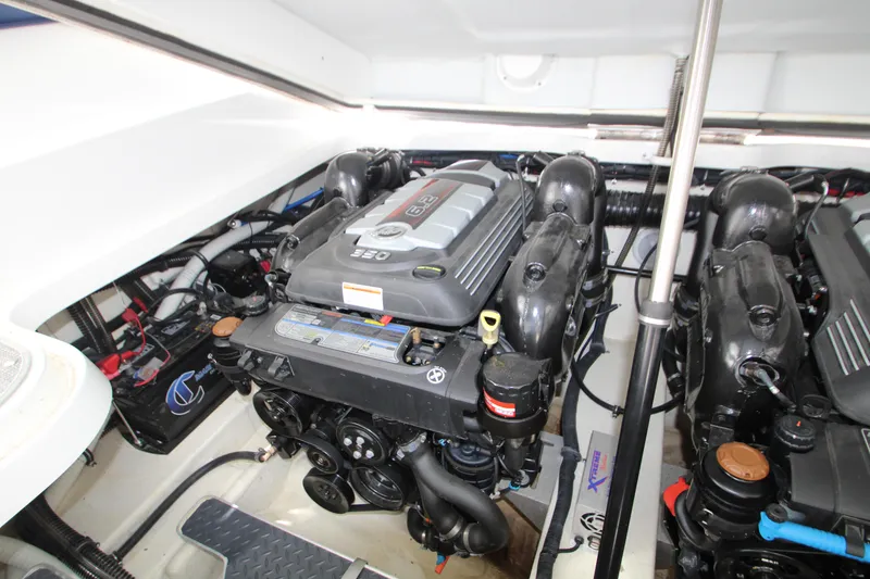 Slide: The Image of Engine compartment of a 2020 Formula 330 Crossover Bowrider, showcasing dual powerful engines. - 25