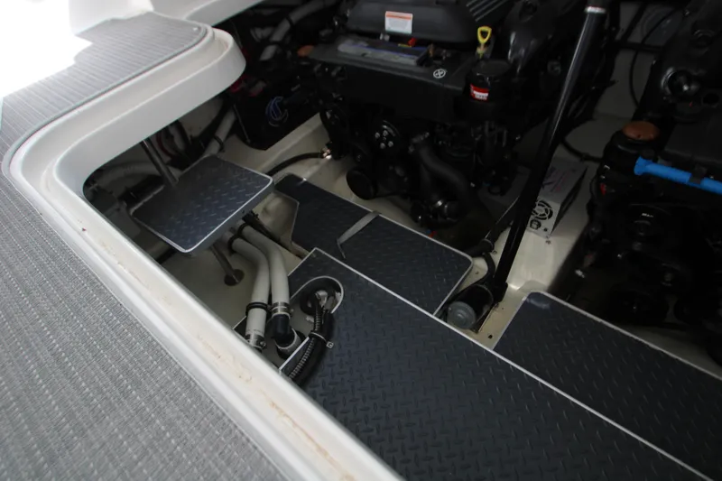 Slide: The Image of Engine compartment of a 2020 Formula 330 Crossover Bowrider, showcasing mechanical components. - 27