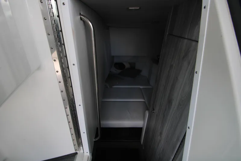 Slide: The Image of 2020 Formula 330 Crossover Bowrider cabin interior with bed and modern design. - 31