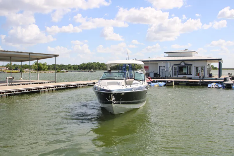 Slide: The Image of 2020 Formula 330 Crossover Bowrider docked on a sunny lake with blue skies. - 35