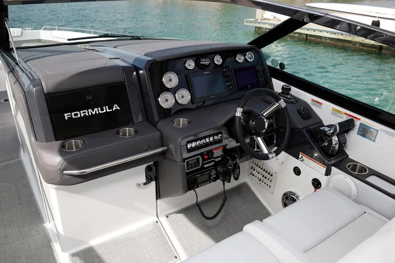 Slide: The Image of Manufacturer Provided Image: 2020 Formula 330 Crossover Bowrider cockpit with modern controls and luxurious seating. - 66