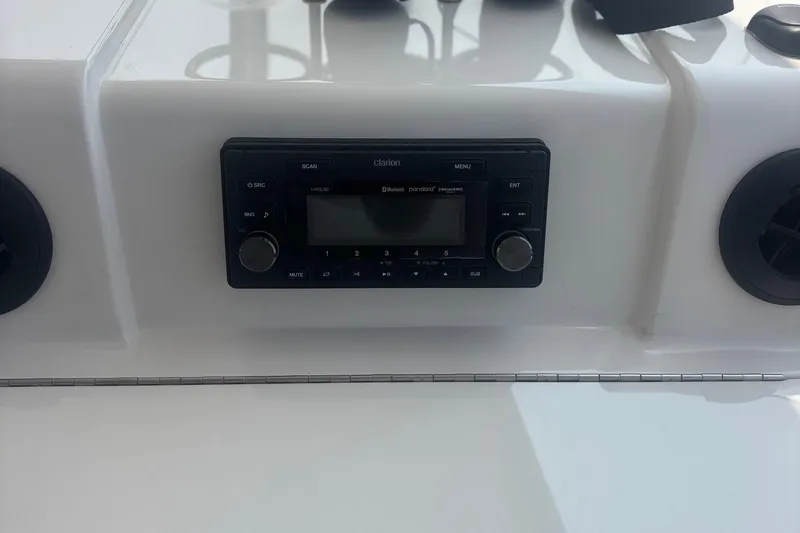 Slide: The Image of Clarion stereo system on 2006 Sea Ray 52 Sedan Bridge yacht dashboard. - 23